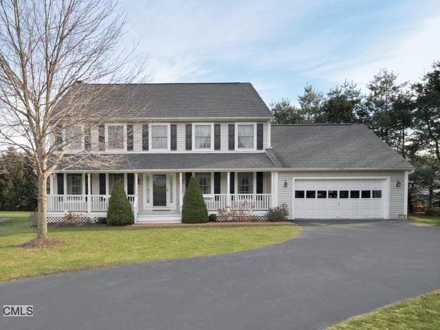 8 Hunt Court Ridgefield, CT 06877 - Photo 1 of 1 a front view of a house with garden