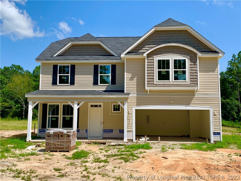 775 Montrose Road Raeford, NC 28376 - Photo 1 of 15 a front view of a house with a yard