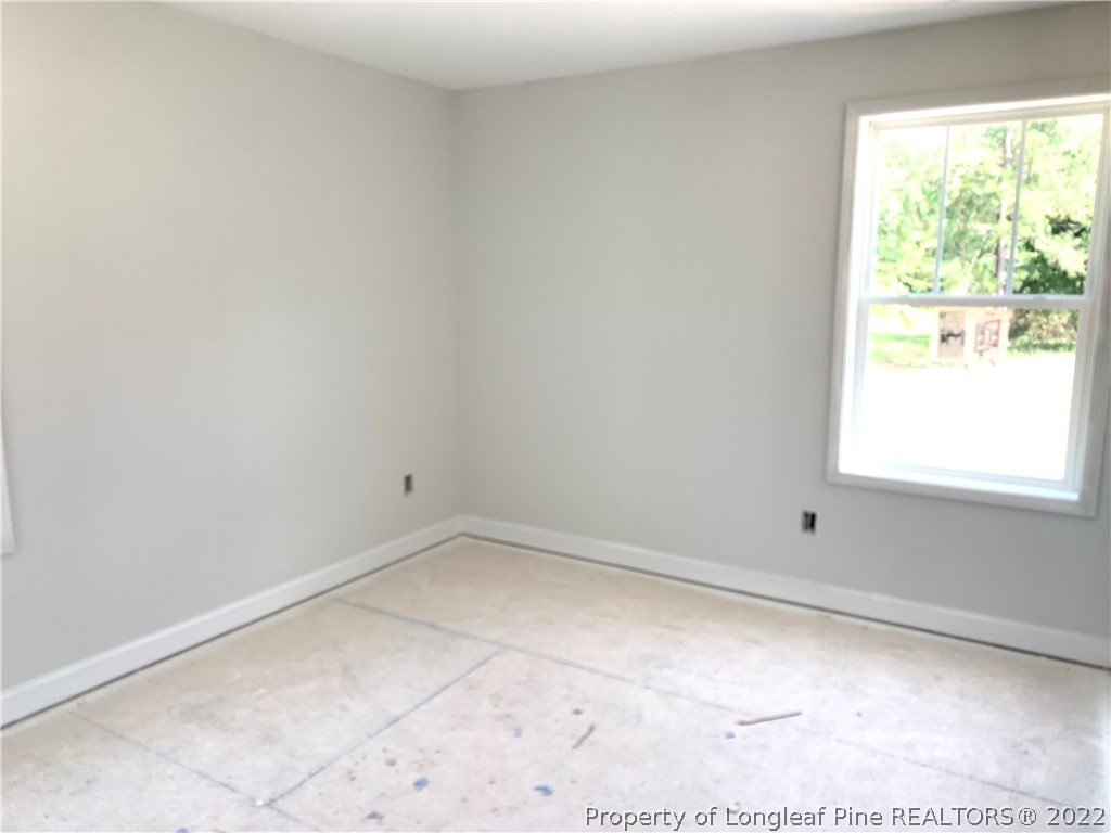 775 Montrose Road Raeford, NC 28376 - Photo 11 of 15 an empty room with a window