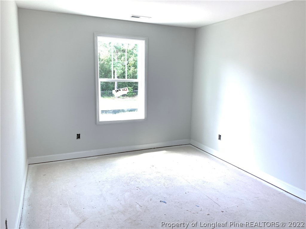 775 Montrose Road Raeford, NC 28376 - Photo 12 of 15 an empty room with a window