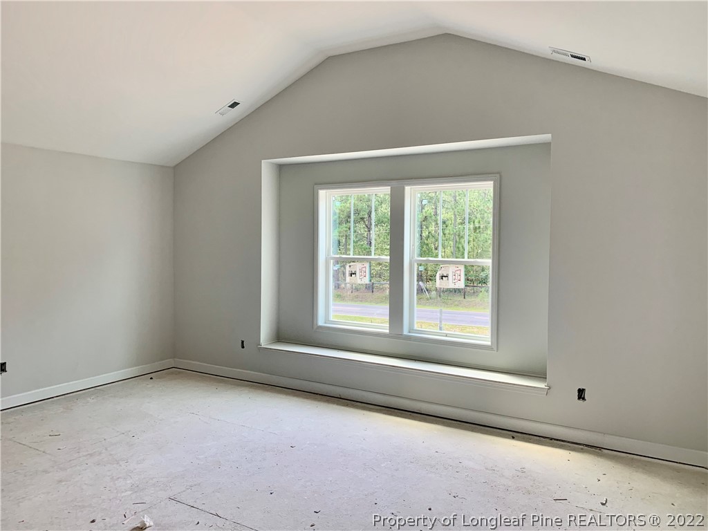 775 Montrose Road Raeford, NC 28376 - Photo 7 of 15 an empty room with a window