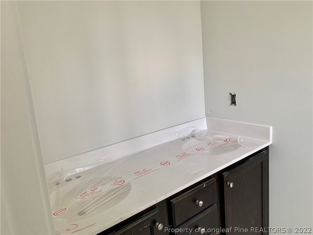 775 Montrose Road Raeford, NC 28376 - Photo 8 of 15 a bathroom with a sink vanity and a