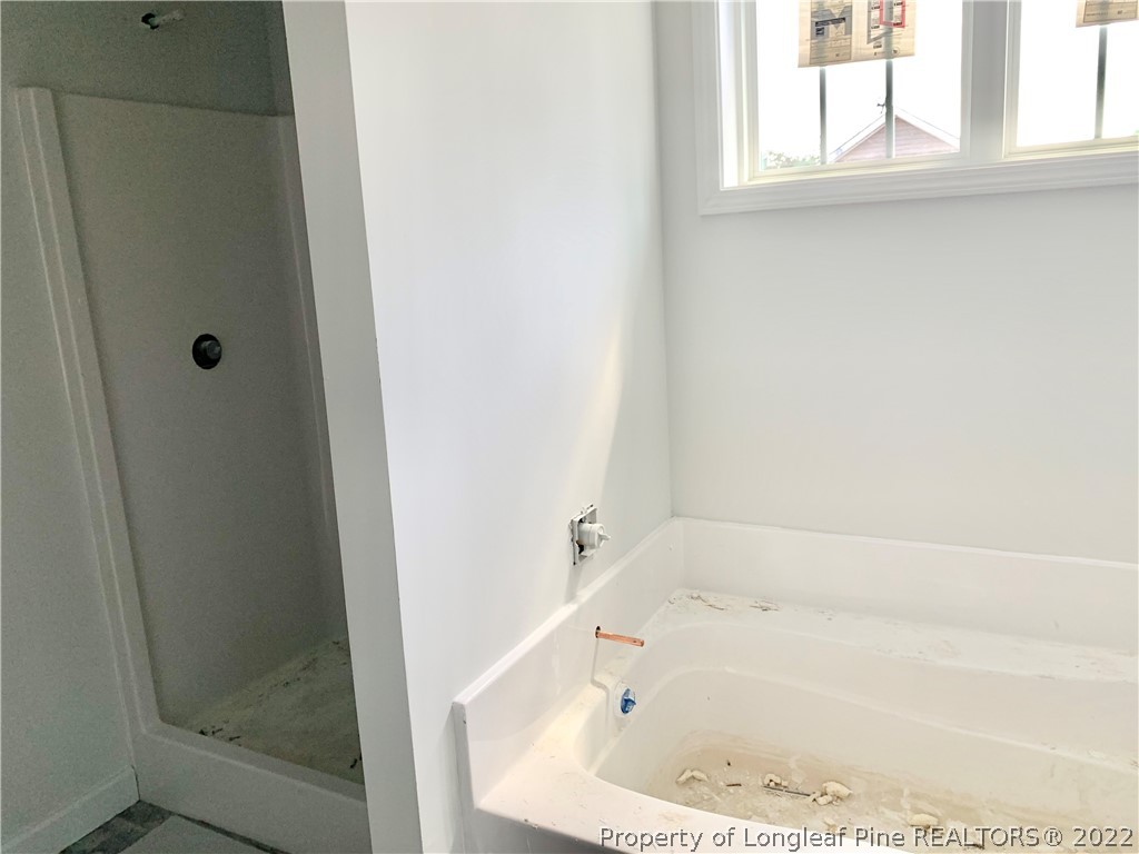 775 Montrose Road Raeford, NC 28376 - Photo 9 of 15 a bathroom with a bathtub