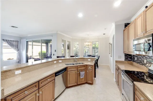 a large kitchen with a stove and cabinets