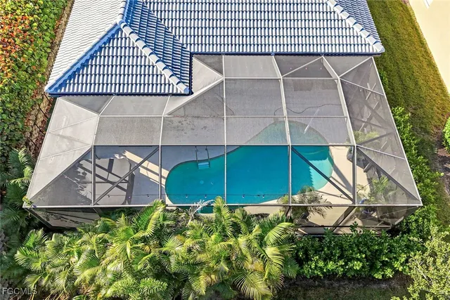 an outdoor view of a house with a backyard