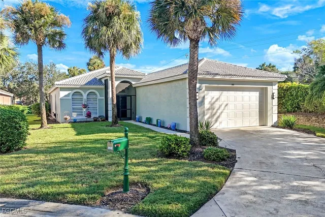 a front view of house with yard and green space