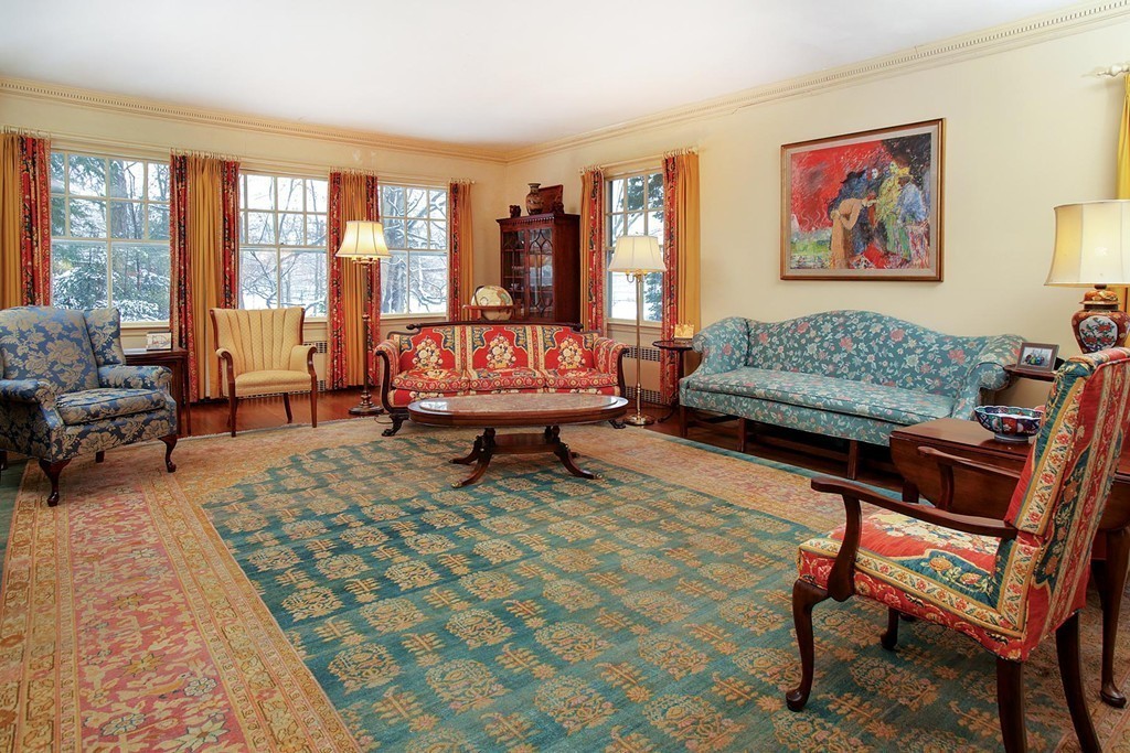 40 Dunster Road Brookline, MA 02467 - Photo 3 of 10 a living room with furniture a rug and a floor to ceiling window