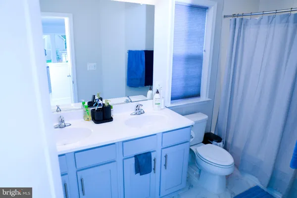 a bedroom with a bed and flat screen tv