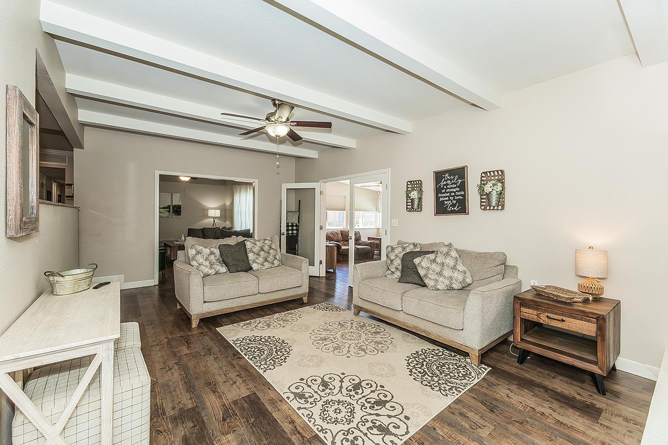 1563 South Klein Avenue Reedley, CA 93654 - Photo 14 of 81 a living room with furniture and a wooden floor