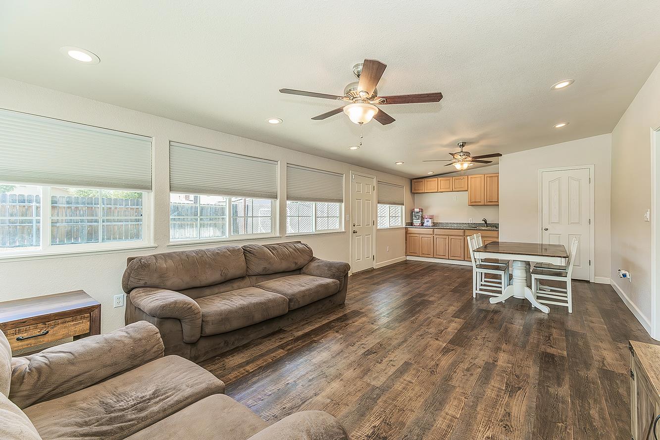 1563 South Klein Avenue Reedley, CA 93654 - Photo 16 of 81 a living room with furniture and a large window