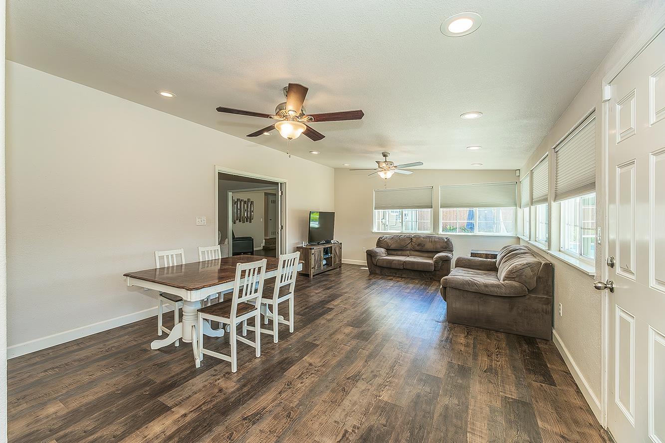 1563 South Klein Avenue Reedley, CA 93654 - Photo 19 of 81 a living room with furniture and a wooden floor