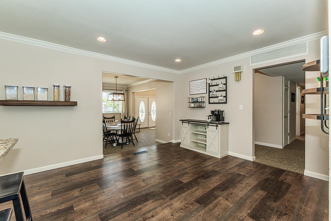 1563 South Klein Avenue Reedley, CA 93654 - Photo 22 of 81 a kitchen with a refrigerator and wooden floor