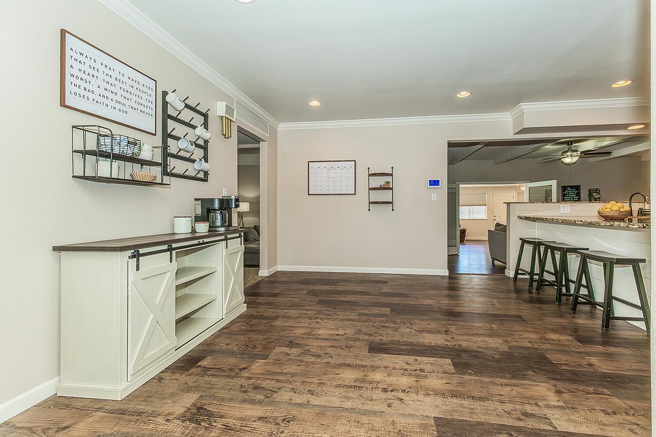 1563 South Klein Avenue Reedley, CA 93654 - Photo 23 of 81 a kitchen with stainless steel appliances granite countertop a stove and a refrigerator
