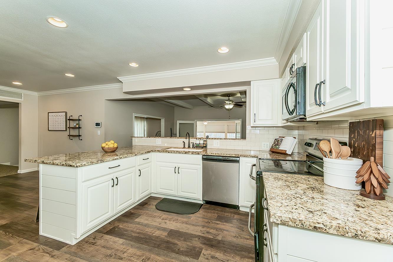 1563 South Klein Avenue Reedley, CA 93654 - Photo 27 of 81 a kitchen with a sink stove and cabinets