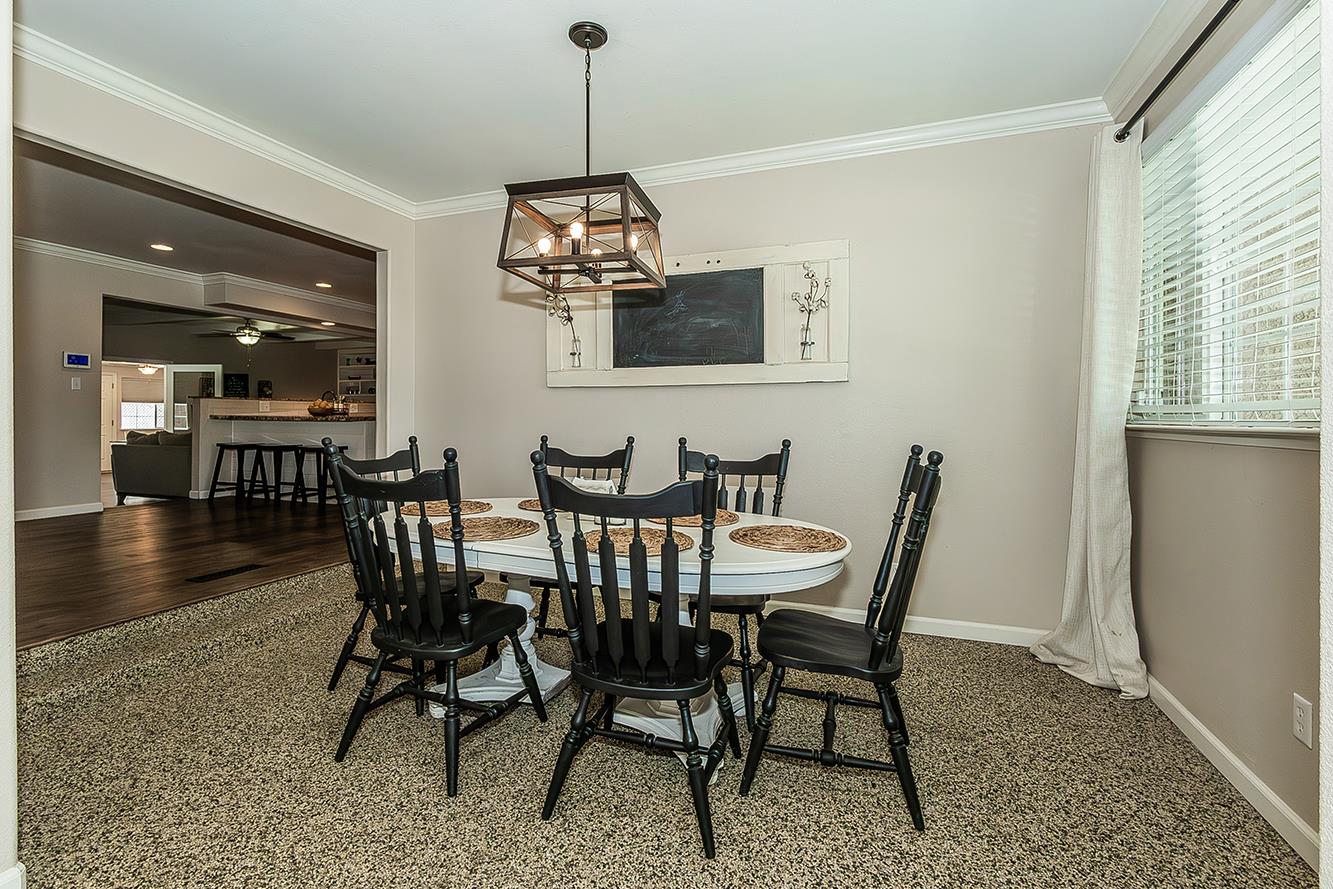 1563 South Klein Avenue Reedley, CA 93654 - Photo 29 of 81 a view of a dining room with furniture window and wooden floor