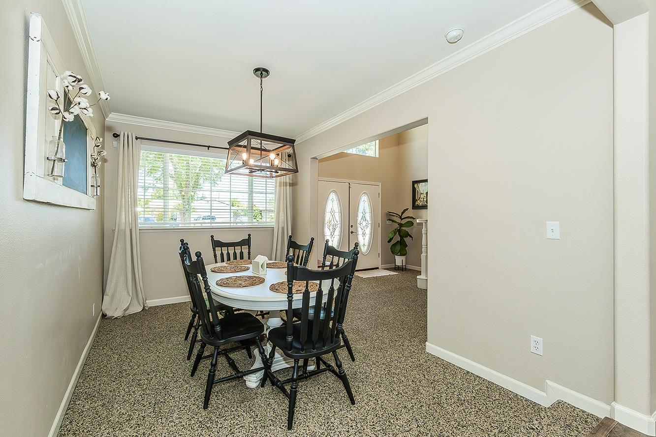 1563 South Klein Avenue Reedley, CA 93654 - Photo 30 of 81 a view of a dining room with furniture window and outside view