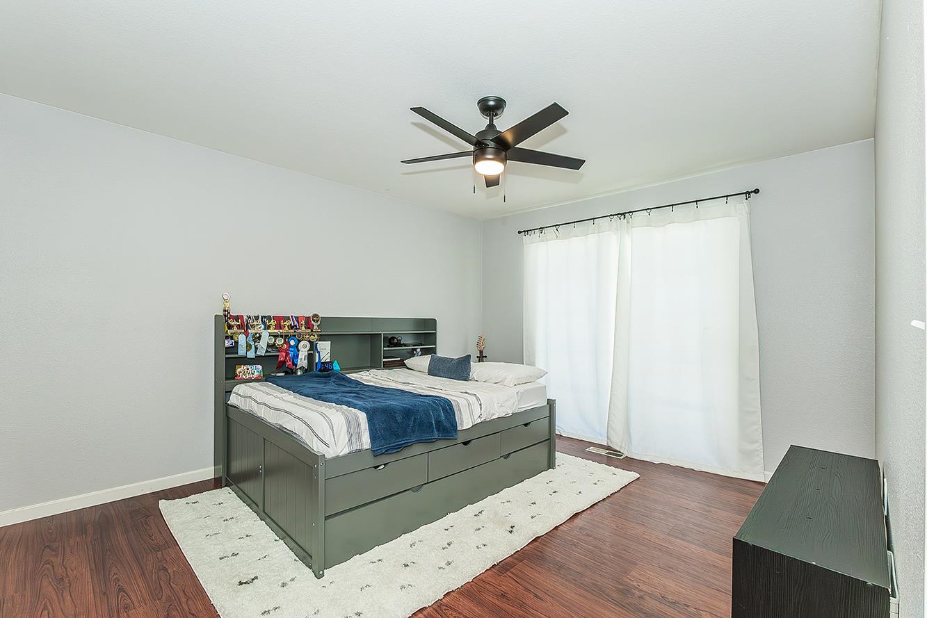 1563 South Klein Avenue Reedley, CA 93654 - Photo 35 of 81 a bedroom with a bed and a window