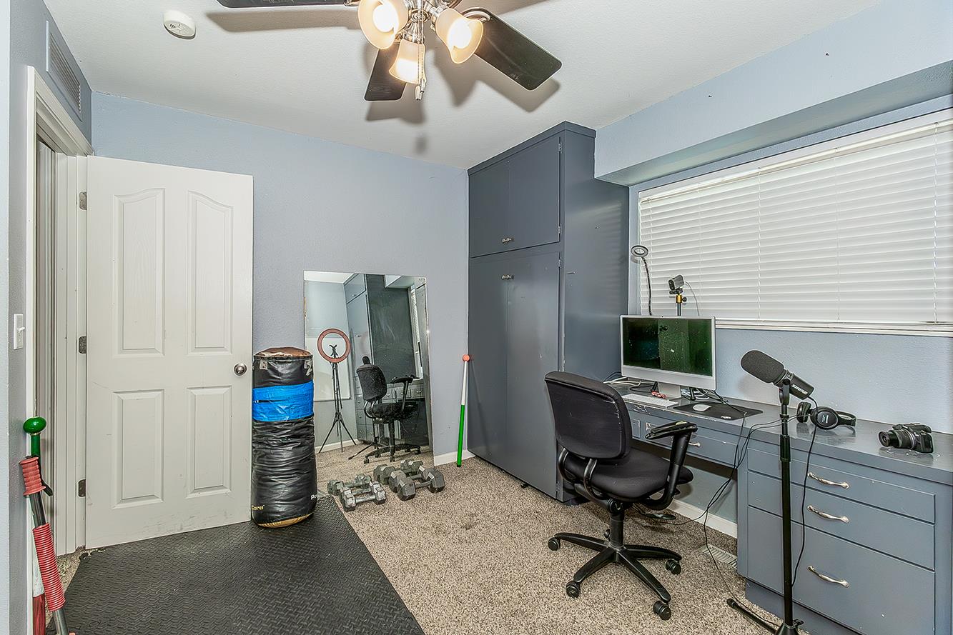 1563 South Klein Avenue Reedley, CA 93654 - Photo 43 of 81 a view of a workspace with furniture and a window