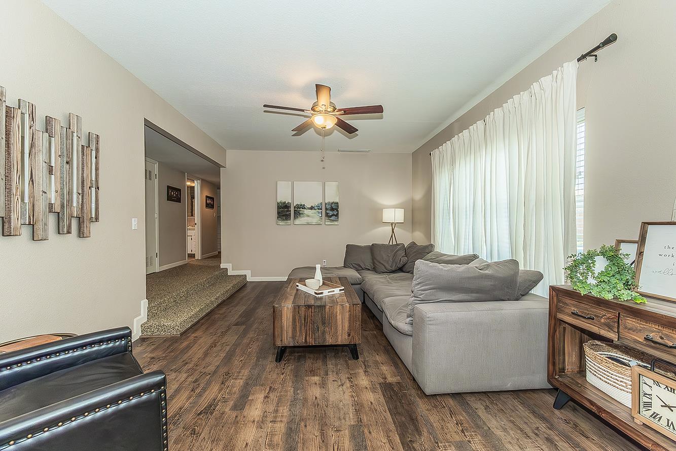1563 South Klein Avenue Reedley, CA 93654 - Photo 5 of 81 a living room with furniture and a large window