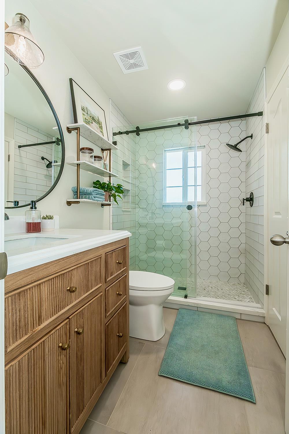 1563 South Klein Avenue Reedley, CA 93654 - Photo 51 of 81 a bathroom with a sink a toilet and shower