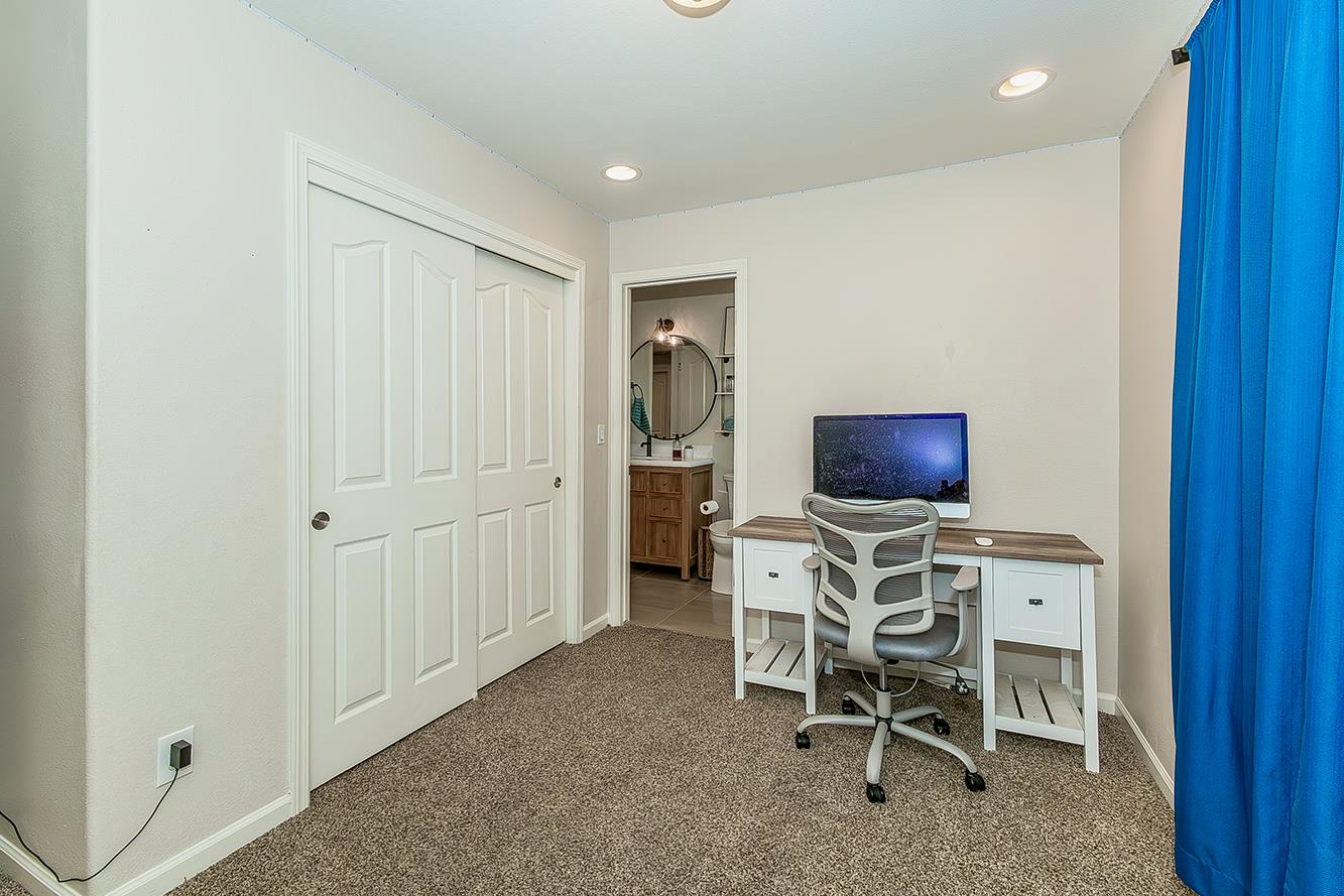 1563 South Klein Avenue Reedley, CA 93654 - Photo 55 of 81 a living room with furniture a flat screen tv and chairs