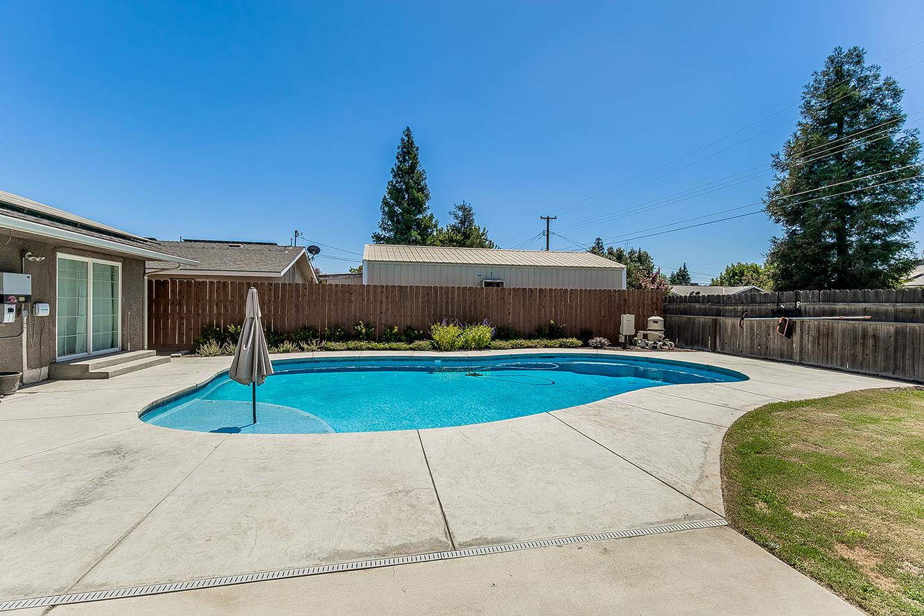 1563 South Klein Avenue Reedley, CA 93654 - Photo 57 of 81 a front view of a house with a yard