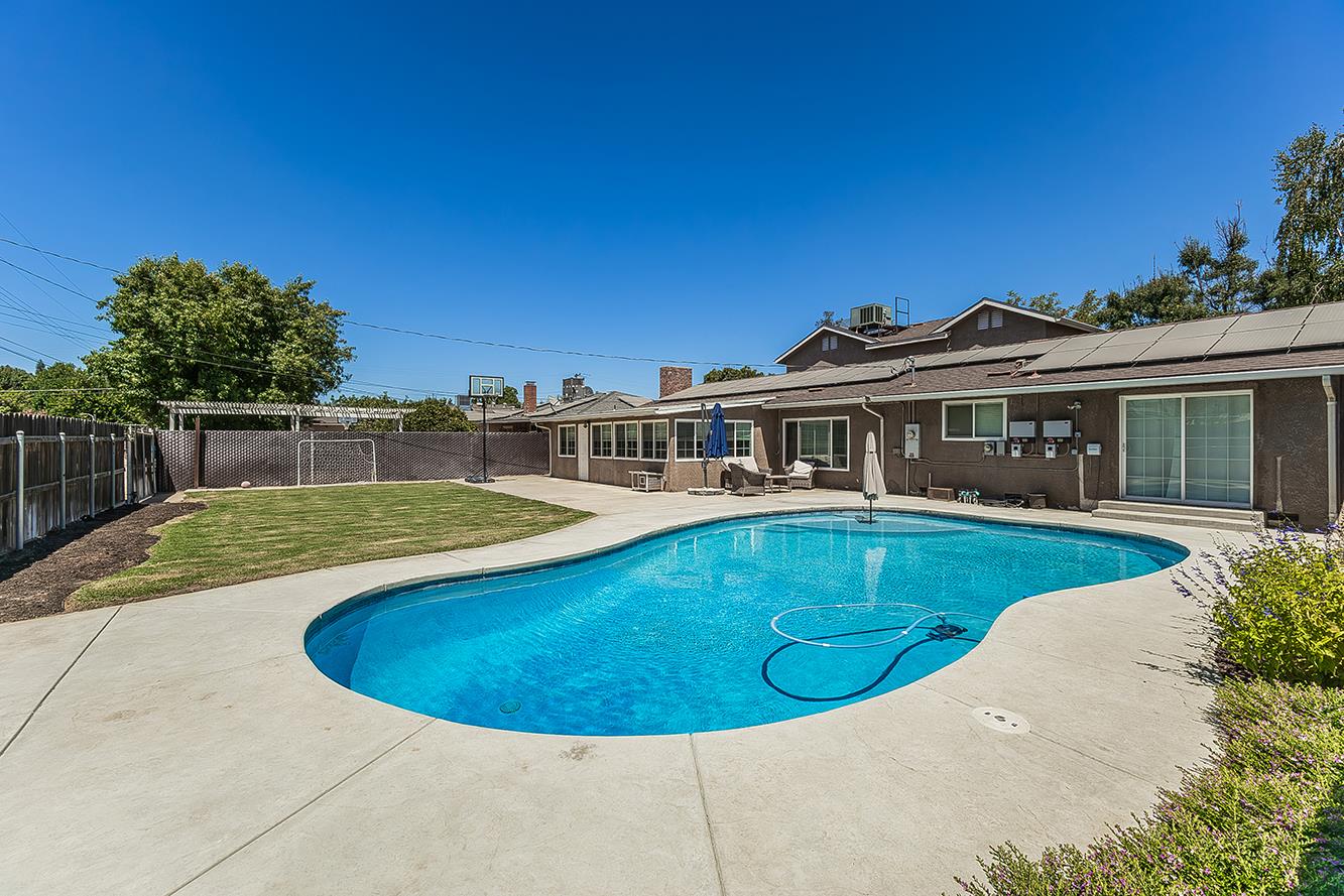 1563 South Klein Avenue Reedley, CA 93654 - Photo 59 of 81 a view of a house with a swimming pool