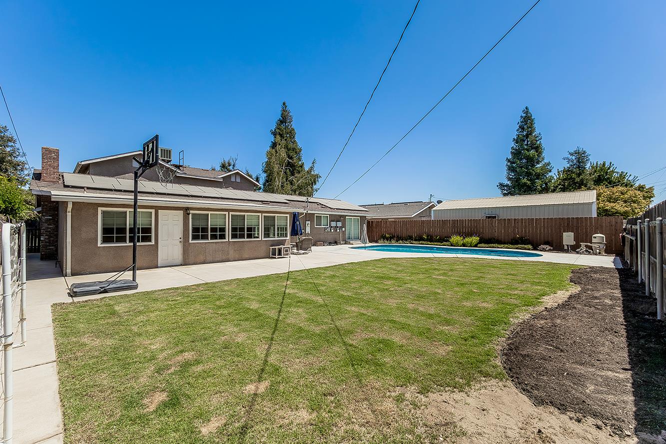 1563 South Klein Avenue Reedley, CA 93654 - Photo 62 of 81 a view of a house with a garden