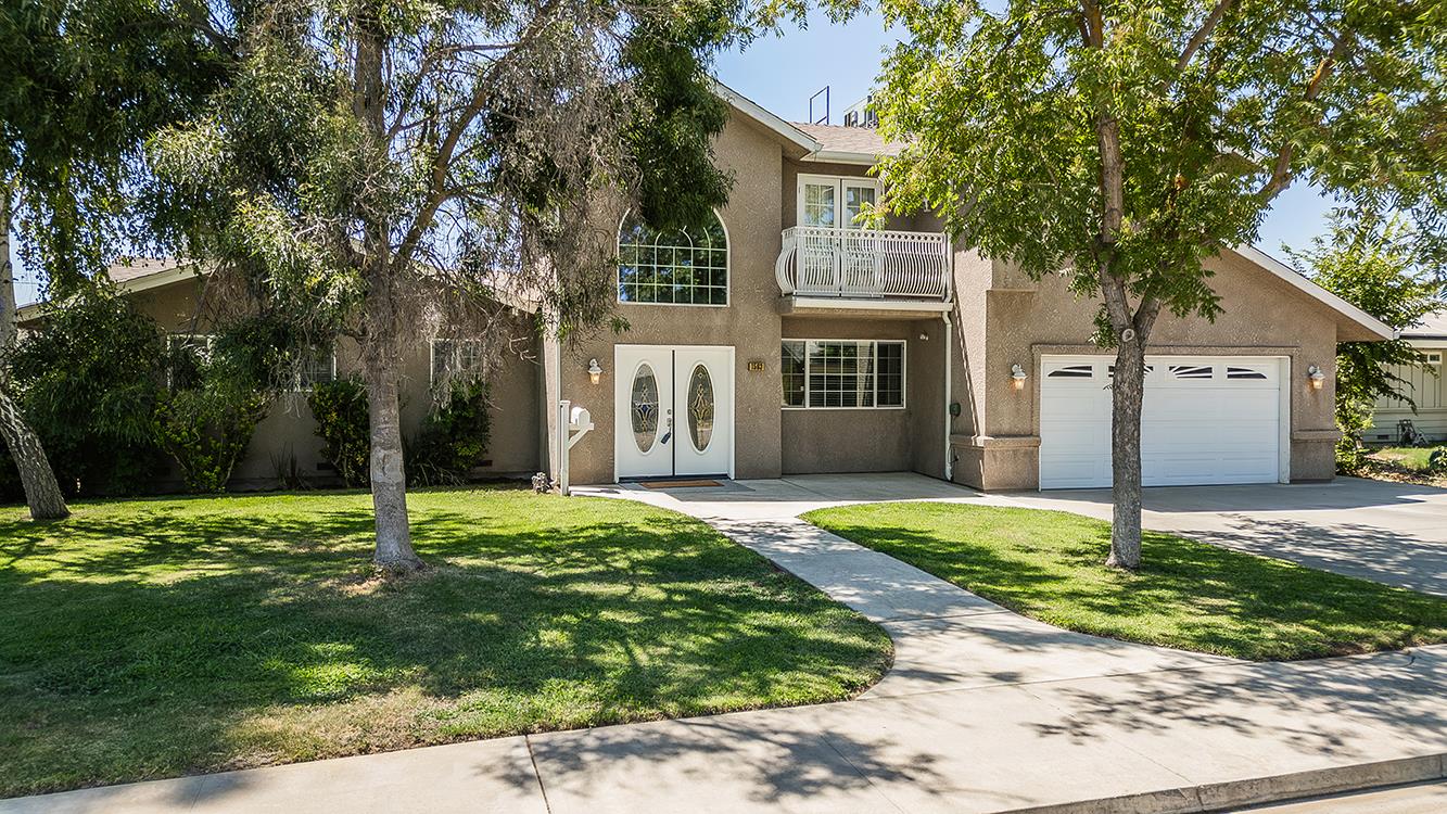 1563 South Klein Avenue Reedley, CA 93654 - Photo 69 of 81 front view of a house with a yard