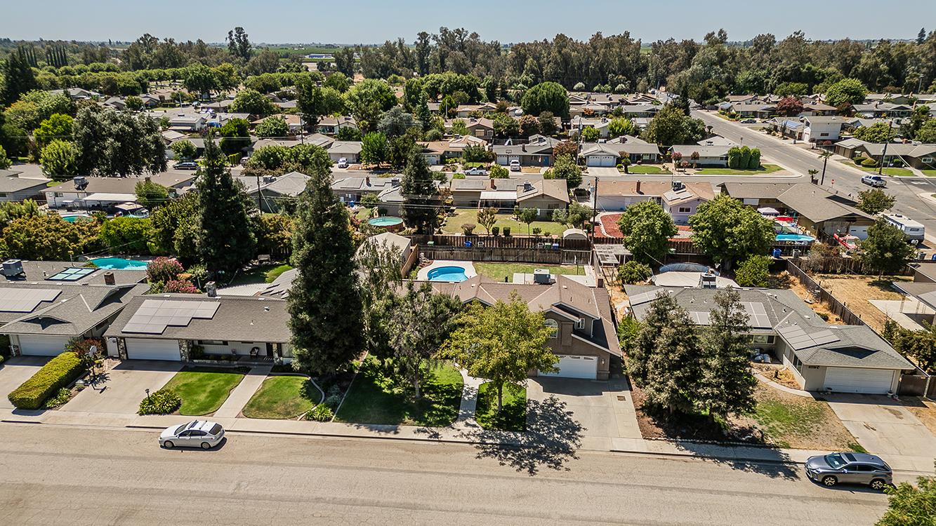 1563 South Klein Avenue Reedley, CA 93654 - Photo 71 of 81 an aerial view of residential houses with outdoor space and street view