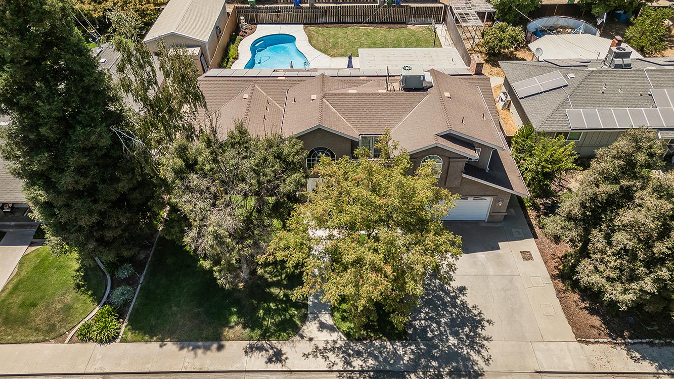 1563 South Klein Avenue Reedley, CA 93654 - Photo 73 of 81 an aerial view of a house with garden space and street view