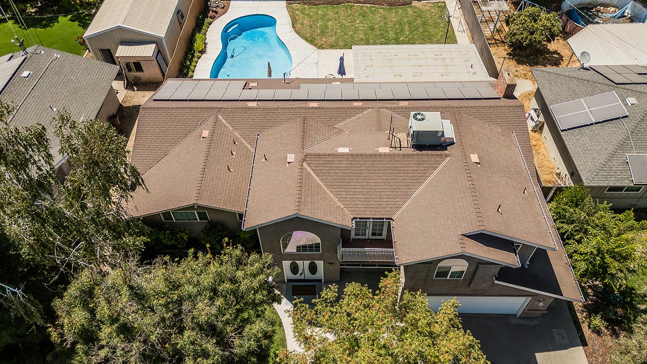 1563 South Klein Avenue Reedley, CA 93654 - Photo 74 of 81 an aerial view of a house with a yard