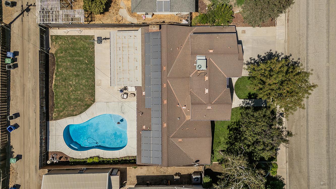 1563 South Klein Avenue Reedley, CA 93654 - Photo 79 of 81 an aerial view of a house with garden space and swimming pool