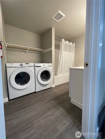 a utility room with dryer and washer