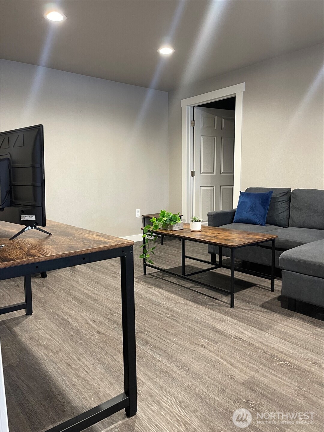59 Elmer City Access Road Coulee Dam, WA 99116 - Photo 19 of 39 a living room with furniture and a flat screen tv