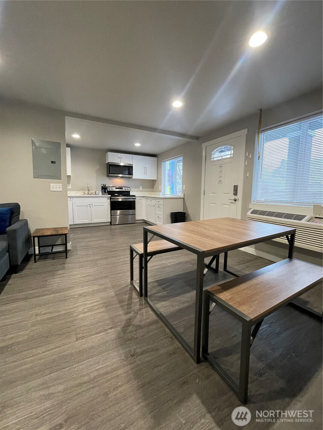 59 Elmer City Access Road Coulee Dam, WA 99116 - Photo 20 of 39 a living room with furniture a flat screen tv and kitchen view