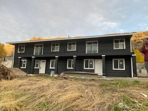 59 Elmer City Access Road Coulee Dam, WA 99116 - Photo 2 of 39 a front view of a house with a yard