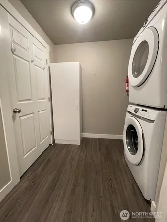 a view of a storage and utility room with washer and dryer