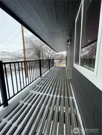 a view of balcony with wooden floor
