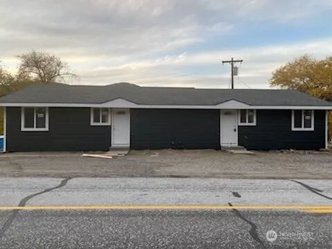 a front view of a house with a garage