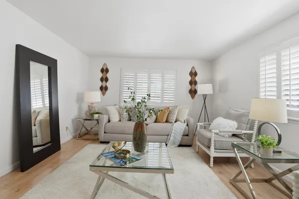 a living room with furniture and a table