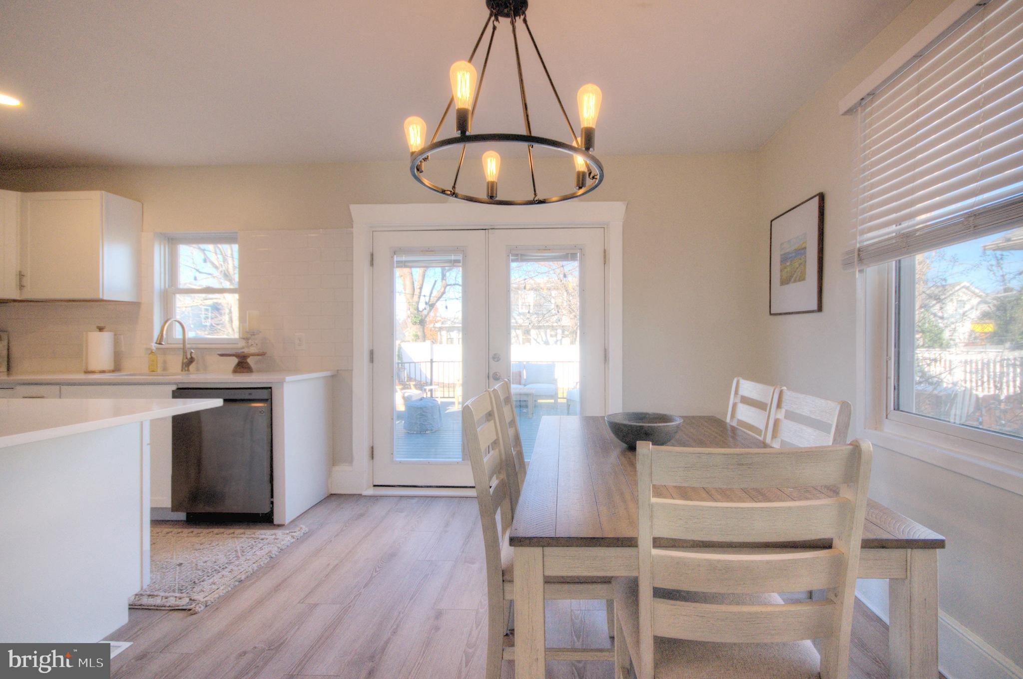 23 East Holly Haddon Township, NJ 08107 - Photo 12 of 35 a kitchen with a refrigerator and wooden floor