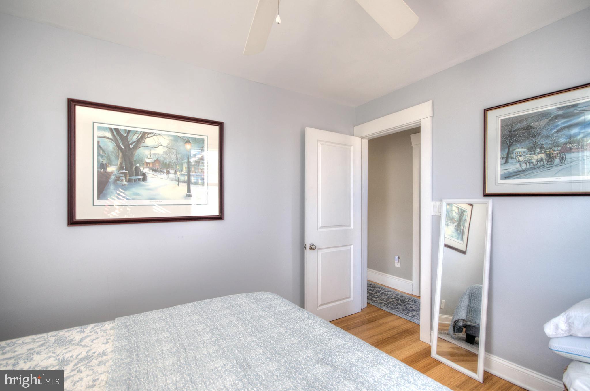 23 East Holly Haddon Township, NJ 08107 - Photo 23 of 35 a bedroom with a bed and a painting on the wall