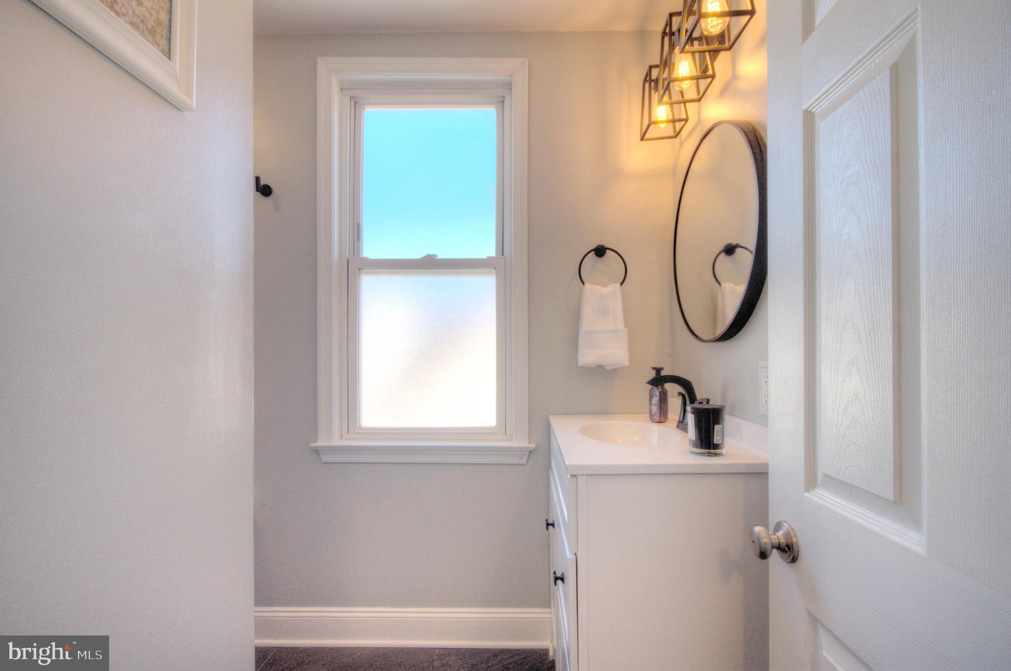 23 East Holly Haddon Township, NJ 08107 - Photo 27 of 35 a bathroom with a sink and a mirror