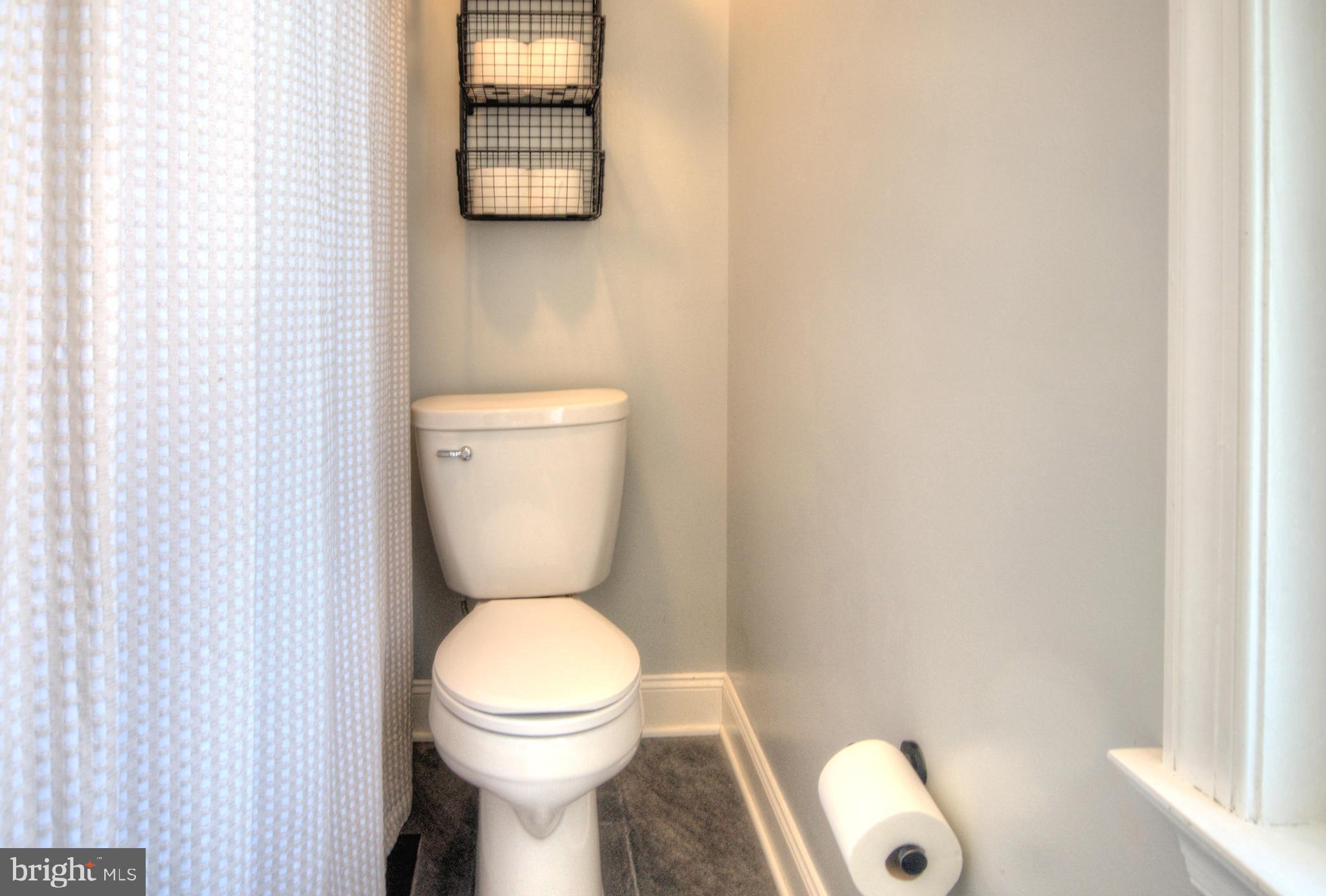 23 East Holly Haddon Township, NJ 08107 - Photo 28 of 35 a white toilet sitting next to a small sink