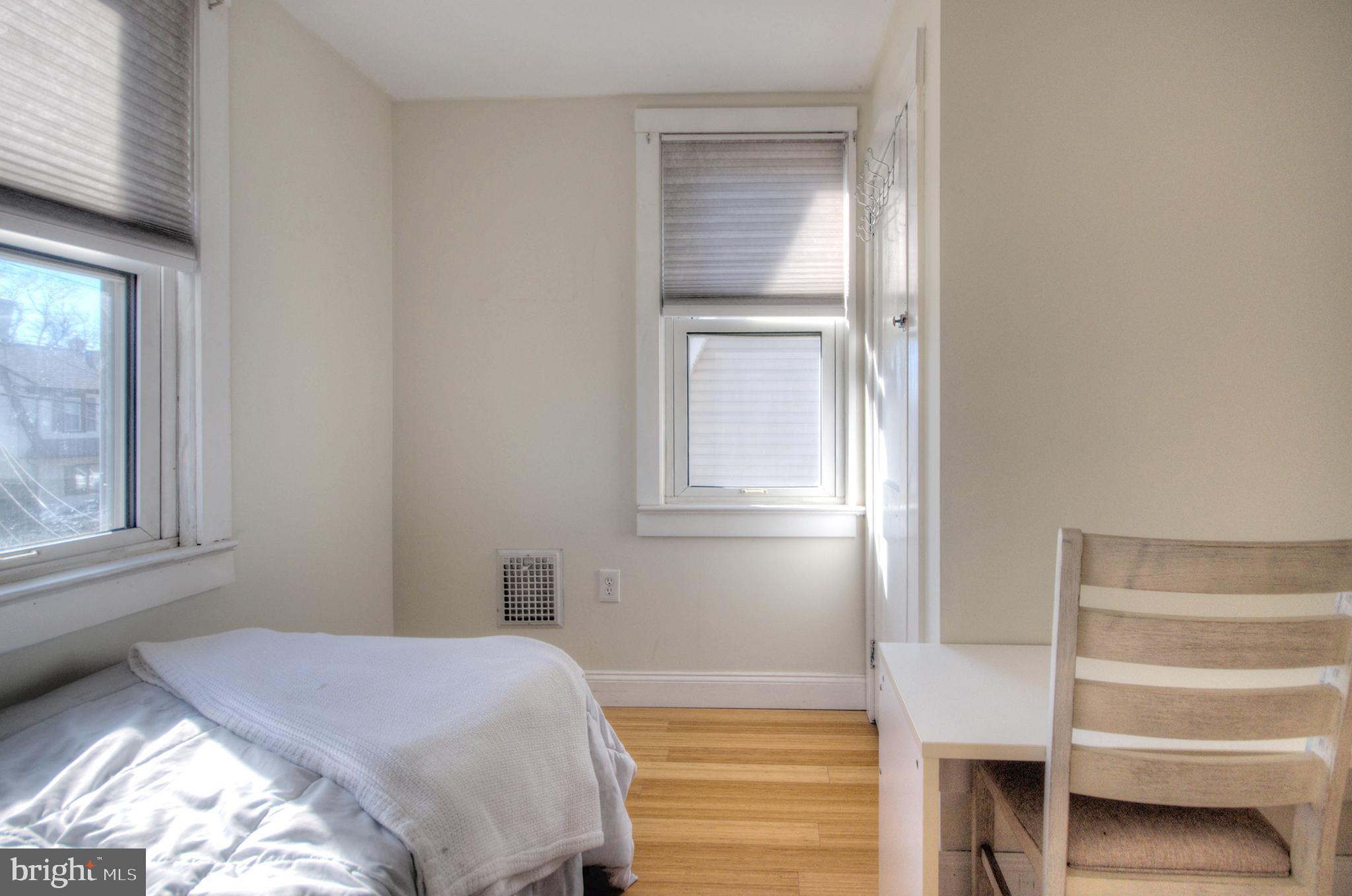 23 East Holly Haddon Township, NJ 08107 - Photo 31 of 35 a bedroom with a bed and a window