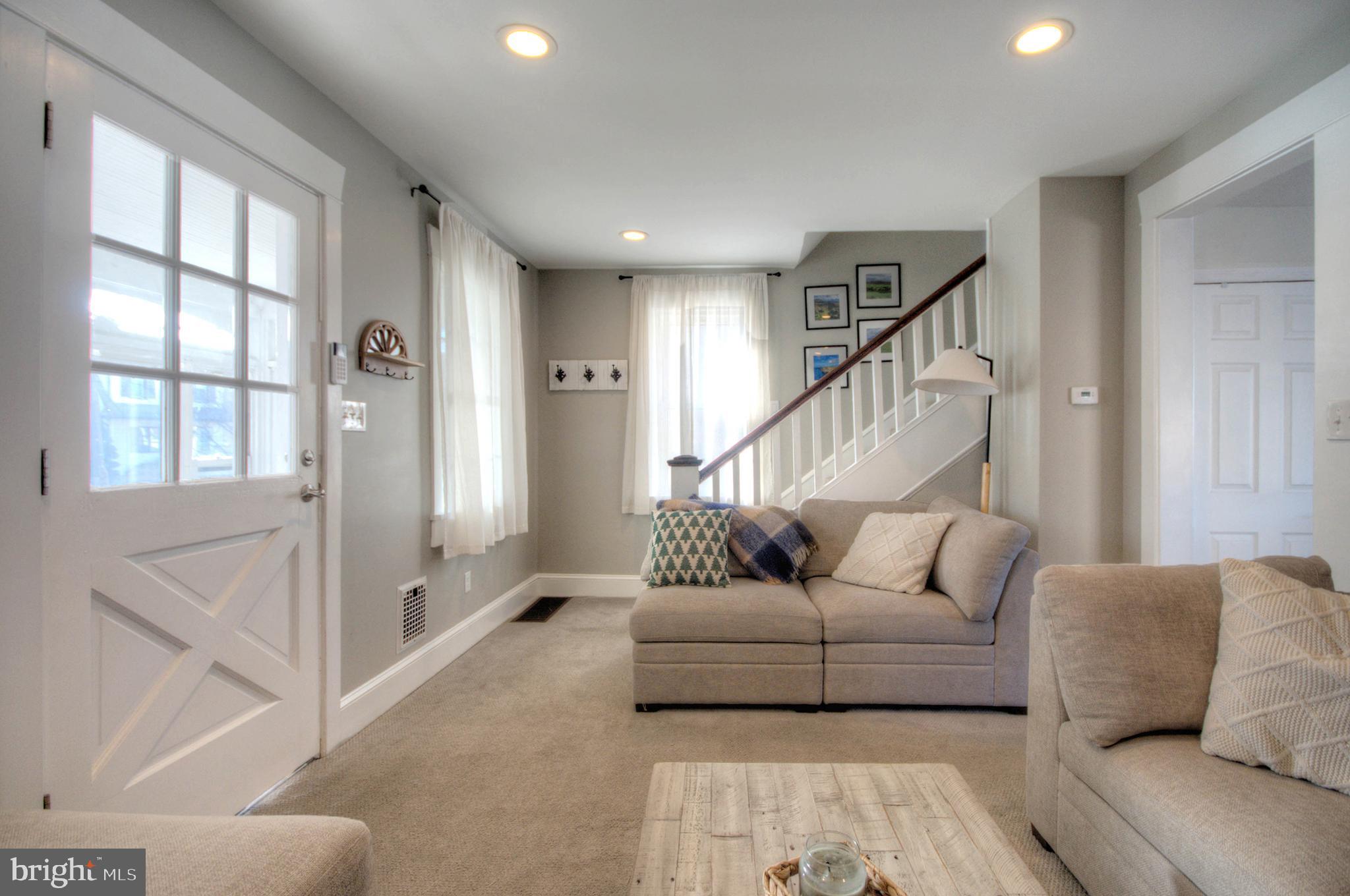 23 East Holly Haddon Township, NJ 08107 - Photo 9 of 35 a living room with furniture and a large window