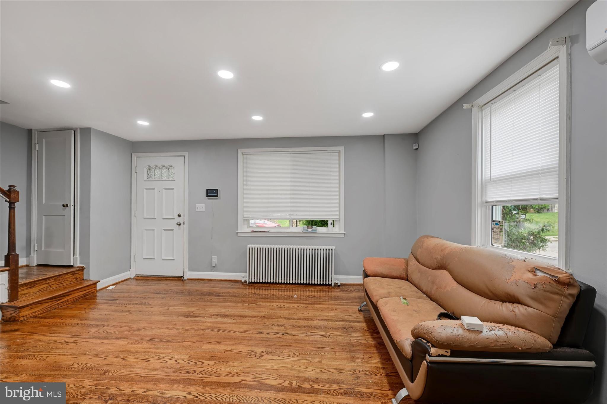 825 Wicklow Road Baltimore, MD 21229 - Photo 3 of 15 a living room with furniture and a window