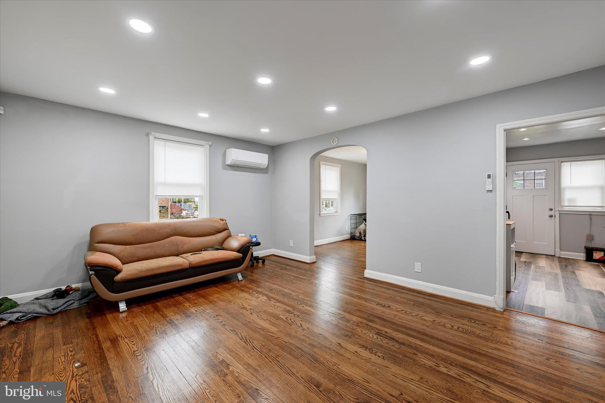 825 Wicklow Road Baltimore, MD 21229 - Photo 4 of 15 a living room with furniture and a wooden floor