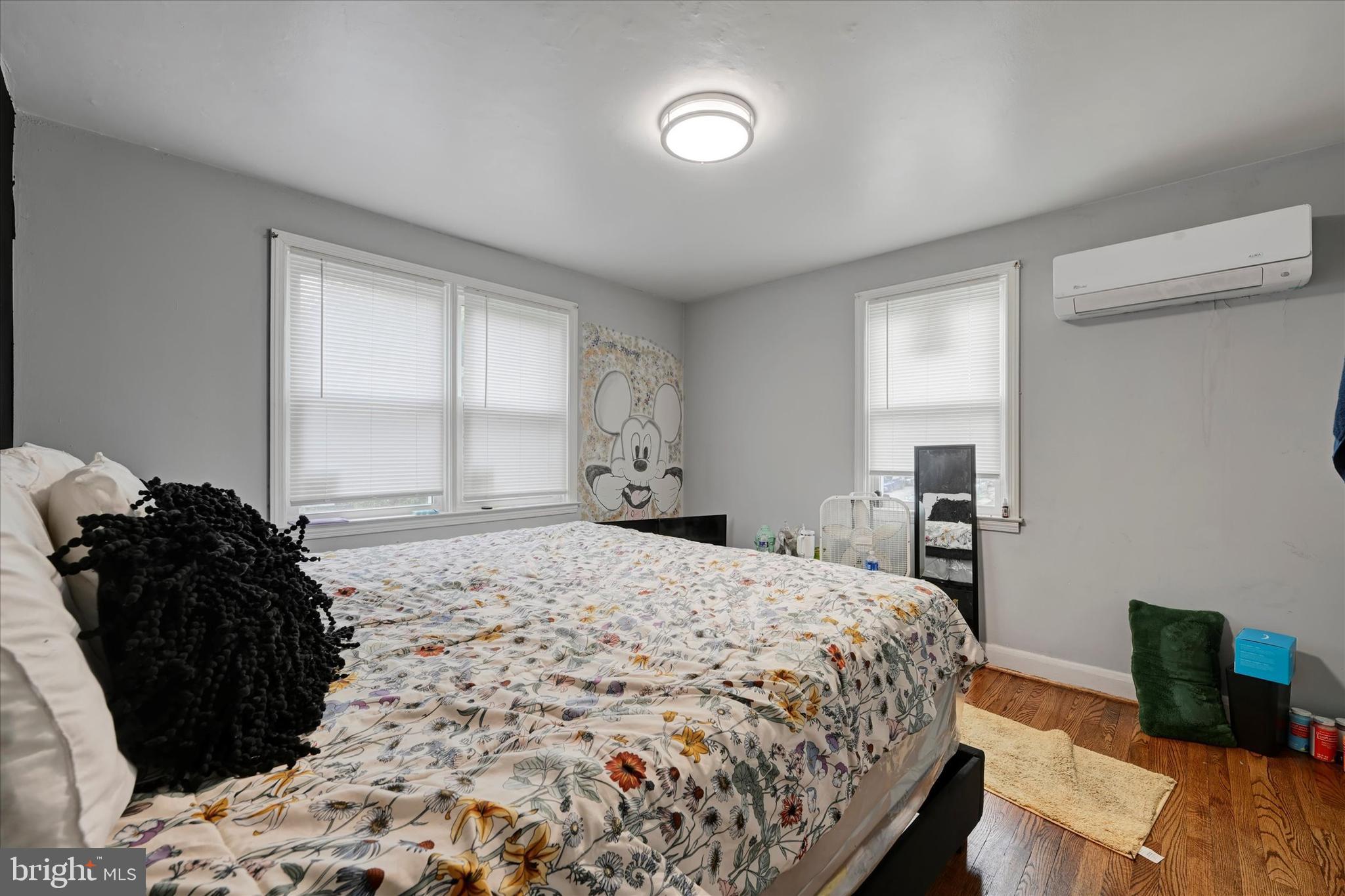825 Wicklow Road Baltimore, MD 21229 - Photo 9 of 15 a bedroom with a bed and a window